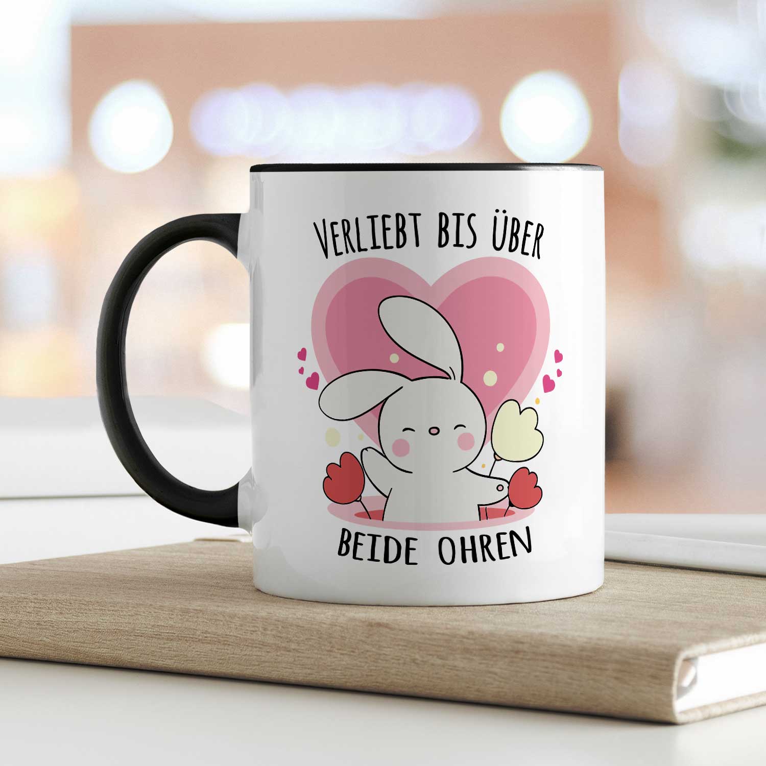 Bedruckte Tasse mit Spruch - Verliebt bis über beide Ohren
