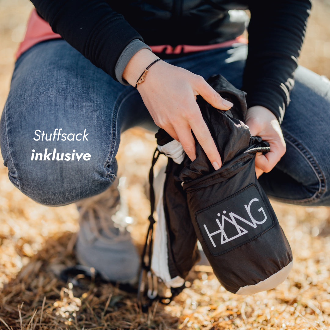 Stuffsack aus Stoff mit HÄNG-Logo zum Verstauen der Hängematte